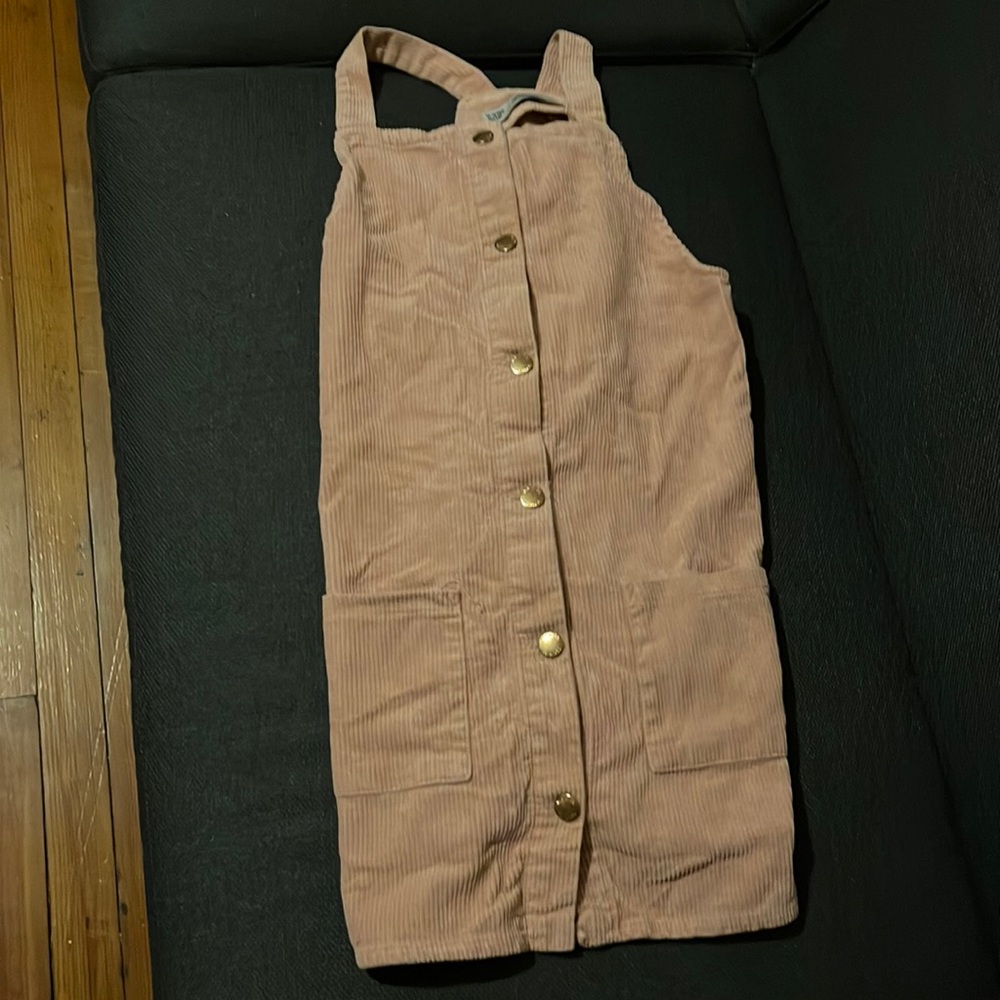 A very pretty dress that is a light pink color